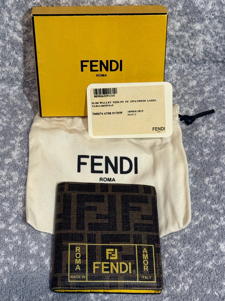 Fendi Bifold Wallet Featuring All Over Ff Logo Print.